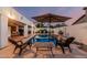 Inviting backyard pool with lounge chairs, patio, and lush landscaping at 6133 E Saddleback St, Mesa, AZ 85215
