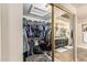 Walk-in closet with custom shelving and built-in vanity area at 6133 E Saddleback St, Mesa, AZ 85215