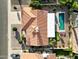 Aerial view showcasing the home's layout, including a pool, patio, and well-maintained landscaping and driveway at 650 E Silver Creek Rd, Gilbert, AZ 85296