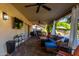 Covered patio with lounge furniture, a barbecue, a fan, and access to pool at 650 E Silver Creek Rd, Gilbert, AZ 85296