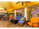 Outdoor covered patio featuring a seating, string lights, and a pool view at 650 E Silver Creek Rd, Gilbert, AZ 85296
