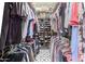 Walk-in closet with shoe shelves and rods for hanging clothes at 650 E Silver Creek Rd, Gilbert, AZ 85296