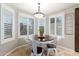 Bright dining area with natural light, a round wood table, and white chairs provides a cozy place to dine at 650 E Silver Creek Rd, Gilbert, AZ 85296