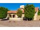 Exterior shot of home featuring desert landscaping, stucco walls, and a red tile roof at 650 E Silver Creek Rd, Gilbert, AZ 85296