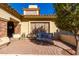 Cozy front porch with stone pavers, bench seating, and charming curb appeal under a bright blue sky at 650 E Silver Creek Rd, Gilbert, AZ 85296