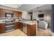 Well-appointed kitchen featuring stainless steel appliances and convenient breakfast bar at 650 E Silver Creek Rd, Gilbert, AZ 85296