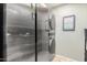 A silver stacked washer/dryer set is the main part of this laundry space at 650 E Silver Creek Rd, Gilbert, AZ 85296