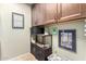 Laundry area showcasing upper cabinets, shelving, and stylish storage baskets at 650 E Silver Creek Rd, Gilbert, AZ 85296