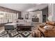 Open-concept living room showcasing hardwood floors, stylish decor, and ample natural light, perfect for relaxing at 650 E Silver Creek Rd, Gilbert, AZ 85296