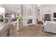 Bright living room with a decorative fireplace, wood floors, and comfortable seating, perfect for entertaining at 650 E Silver Creek Rd, Gilbert, AZ 85296