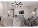 Cozy living room features a ceiling fan, blue dresser, and comfortable seating at 650 E Silver Creek Rd, Gilbert, AZ 85296