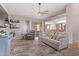 Comfortable living room with a ceiling fan, sliding door to the patio, and neutral decor at 650 E Silver Creek Rd, Gilbert, AZ 85296
