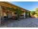 Backyard patio with lounge furniture and lovely lush landscaping at 650 E Silver Creek Rd, Gilbert, AZ 85296