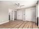 Spacious bedroom with multiple closets, wood-look floors, and open layout at 6751 W Cameron Dr, Peoria, AZ 85345
