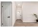 Bright entryway featuring wood-look tile floors, fresh paint and a white front door at 6751 W Cameron Dr, Peoria, AZ 85345