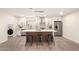 Stylish kitchen featuring a large island with seating, stainless steel appliances, and custom backsplash at 6751 W Cameron Dr, Peoria, AZ 85345