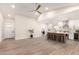 Open-concept living space featuring modern kitchen with a large island and stainless appliances at 6751 W Cameron Dr, Peoria, AZ 85345