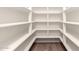 Walk-in pantry with custom built-in shelving to store groceries and small appliances at 6751 W Cameron Dr, Peoria, AZ 85345