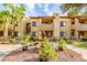 Attractive building exterior with mature landscaping and a decorative water feature at 7008 E Gold Dust Ave # 236, Scottsdale, AZ 85253