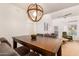 Dining room view featuring a dining table, pendant light, and view into the living room at 7008 E Gold Dust Ave # 236, Scottsdale, AZ 85253