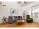 Inviting living area with neutral decor, a comfortable sofa, and lots of natural light at 7008 E Gold Dust Ave # 236, Scottsdale, AZ 85253