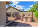 Backyard with grassy area, brick wall, brick patio and lush vegetation at 715 N Cholla St, Chandler, AZ 85224