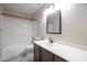 Bathroom featuring a tub and shower combo, dark wood vanity and a tiled floor at 715 N Cholla St, Chandler, AZ 85224