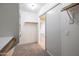 Walk-in closet features wooden bars and shelving for ample storage at 715 N Cholla St, Chandler, AZ 85224