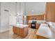 Modern kitchen with stainless steel appliances, spacious island, and ample counter space at 715 N Cholla St, Chandler, AZ 85224