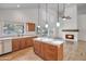 Open concept kitchen featuring a modern island, lots of counter space and a fireplace at 715 N Cholla St, Chandler, AZ 85224