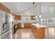 Bright kitchen featuring stainless steel appliances, an island and beautiful wood cabinets at 715 N Cholla St, Chandler, AZ 85224