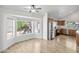 Open concept living room with breakfast nook and views of the kitchen and backyard at 715 N Cholla St, Chandler, AZ 85224