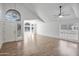 Well-lit living area with hardwood floors, arched windows, and high ceilings at 715 N Cholla St, Chandler, AZ 85224