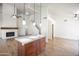 Spacious living area with fireplace, vaulted ceilings, and modern lighting fixtures at 715 N Cholla St, Chandler, AZ 85224