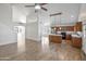 Open-concept living space featuring hardwood floors, natural light, and vaulted ceilings at 715 N Cholla St, Chandler, AZ 85224