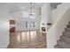 Living room featuring a fireplace, staircase, and open access to the kitchen at 715 N Cholla St, Chandler, AZ 85224