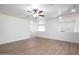 Spacious living room with ceiling fan, wood floors, and lots of light at 715 N Cholla St, Chandler, AZ 85224