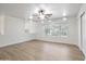 Spacious living room with ceiling fan, wood floors, and lots of light at 715 N Cholla St, Chandler, AZ 85224