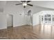 Spacious room with hardwood floors, high ceilings, and a decorative fan at 715 N Cholla St, Chandler, AZ 85224