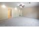 Large main bedroom features neutral walls, carpet, and ceiling fan at 715 N Cholla St, Chandler, AZ 85224