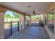 Relaxing covered patio featuring a ceiling fan and views of the pool and landscaped backyard at 715 N Cholla St, Chandler, AZ 85224
