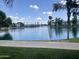 Picturesque pond in a community with palm trees, townhouses, and fountains at 715 N Cholla St, Chandler, AZ 85224