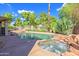 Resort-style pool and spa with rock accents, perfect for relaxation and outdoor enjoyment at 715 N Cholla St, Chandler, AZ 85224