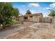 The home's backyard has an artificial turf lawn, a patio, and an uncovered parking space at 7250 E Mckellips Rd, Scottsdale, AZ 85257