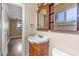 A well lit half bath has a single sink, a vanity, and a mirror at 7250 E Mckellips Rd, Scottsdale, AZ 85257