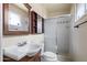 A full bathroom features a sink and vanity, with a standing shower with sliding glass doors at 7250 E Mckellips Rd, Scottsdale, AZ 85257