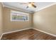 Bright bedroom with laminate floors, crown molding, and a window for natural light at 7250 E Mckellips Rd, Scottsdale, AZ 85257