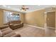 Inviting living room with tile flooring, neutral paint, and a large window offering ample natural light at 7250 E Mckellips Rd, Scottsdale, AZ 85257