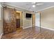 This main bedroom has wood floors, large closet with a barn door, and a ceiling fan at 7250 E Mckellips Rd, Scottsdale, AZ 85257