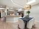 Cozy dining area adjacent to the kitchen, featuring modern lighting and stylish decor for comfortable dining at 7955 E Chaparral Rd # 115, Scottsdale, AZ 85250